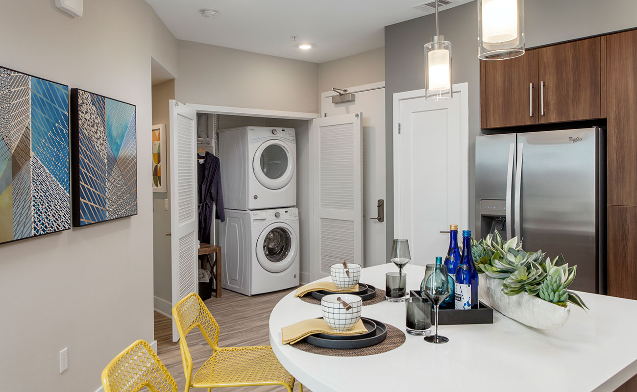 Apartments in Irvine-The Royce Modern Kitchen with Matching Appliances, Spacious Countertops, and Hidden Washer and Dryer